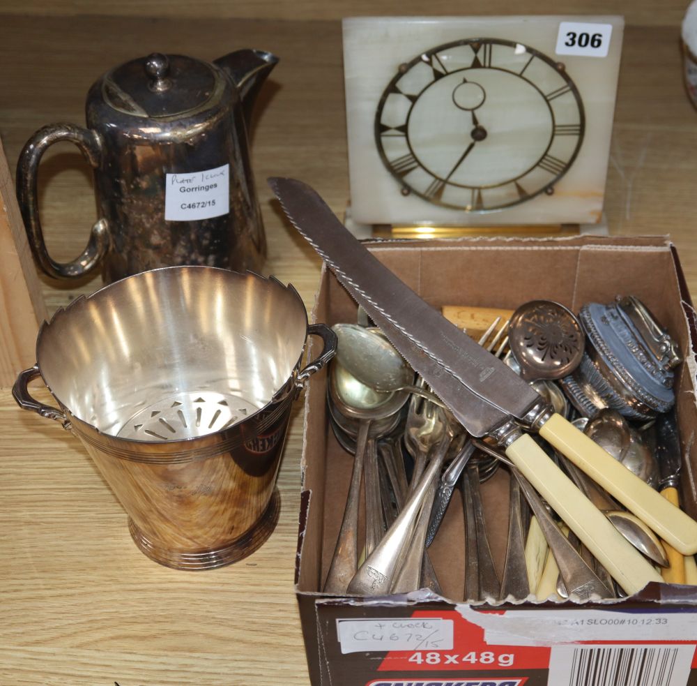 A quantity of assorted plated flatware together an Art Deco style onyx mantel timepiece